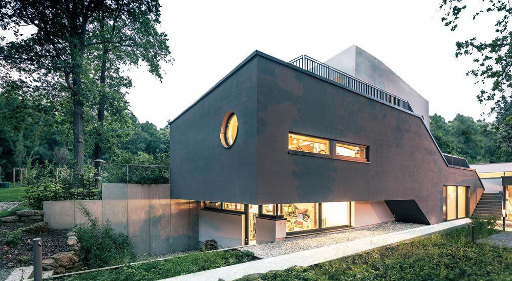 Ein modernes Einfamilienhaus - dunkle Fassade, schöner Garten, Architekturbüro Wien